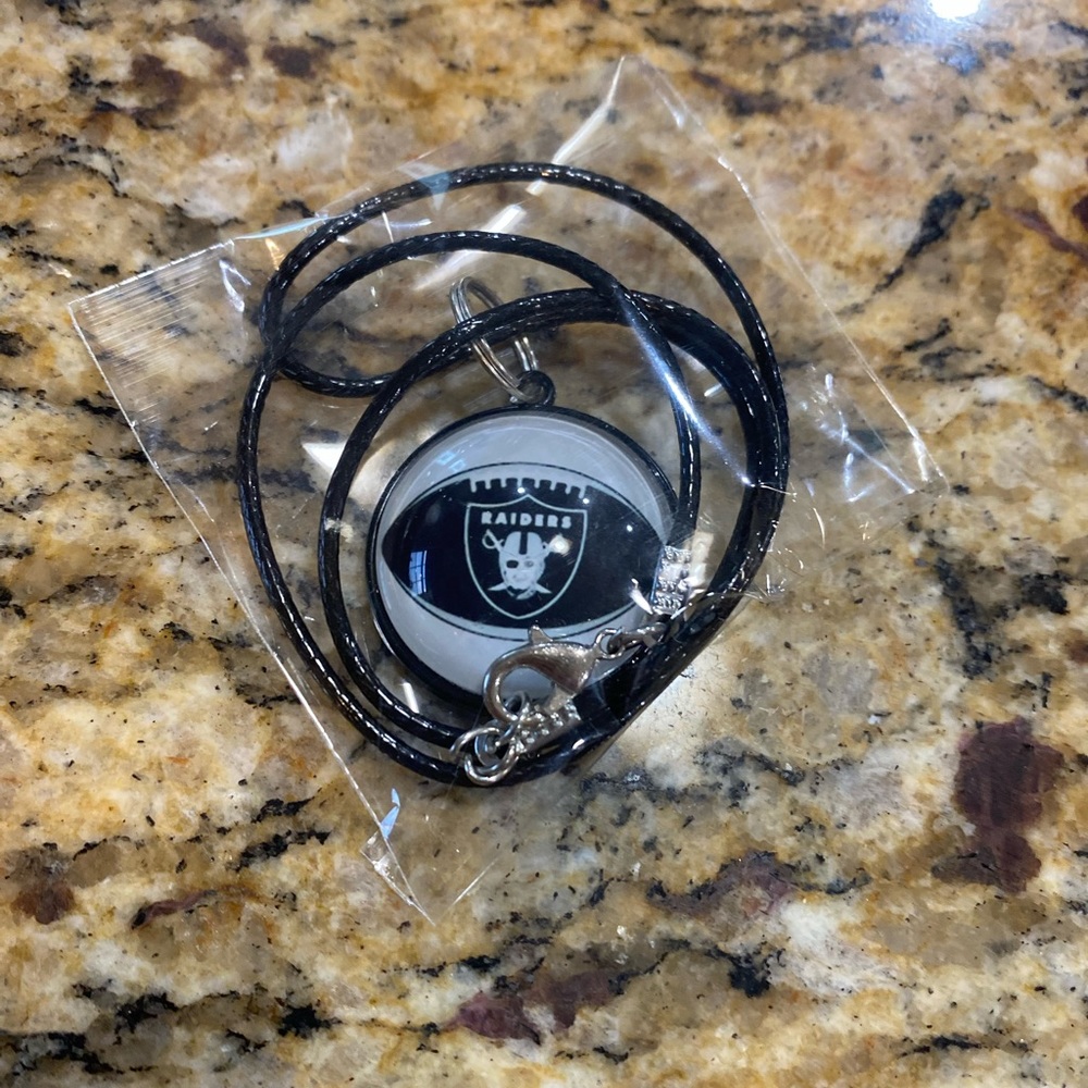 Raiders bracelet and necklaces. One bracelet, two necklaces.